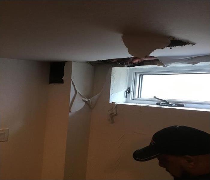 pipe burst causing damage to ceiling and walls