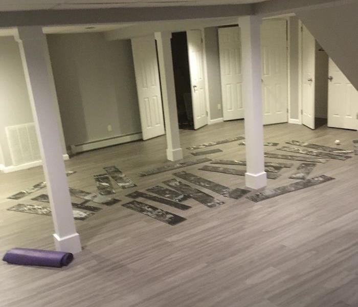 Wood floor with removed flooring upside down on it