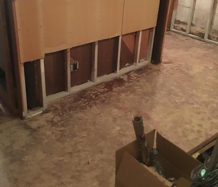 Basement with plywood walls cut away along the bottom