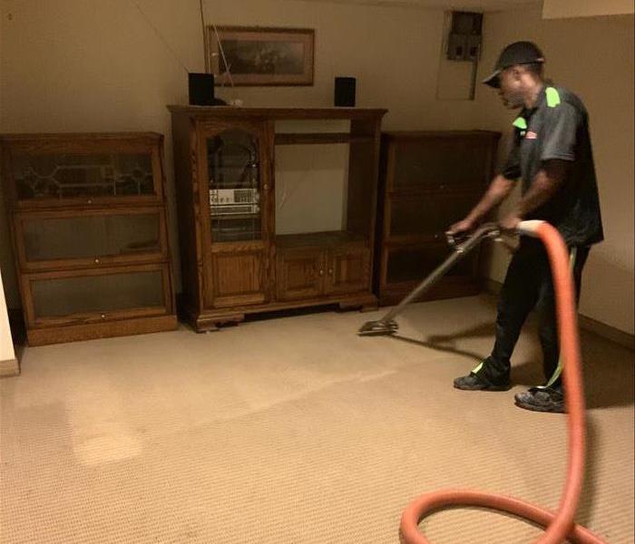 technician applying the finishing pass over after cleanup of the carpet