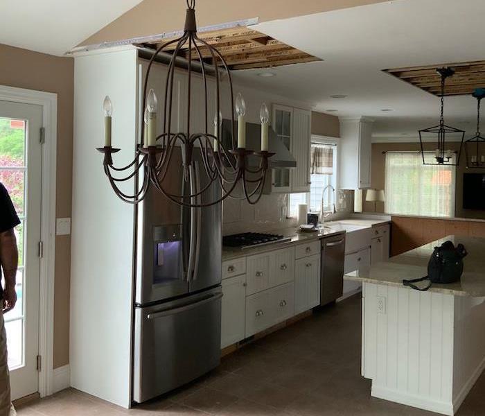 Kitchen with cut out ceiling portions 