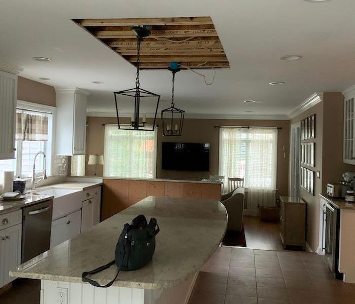 Kitchen with hole in the ceiling