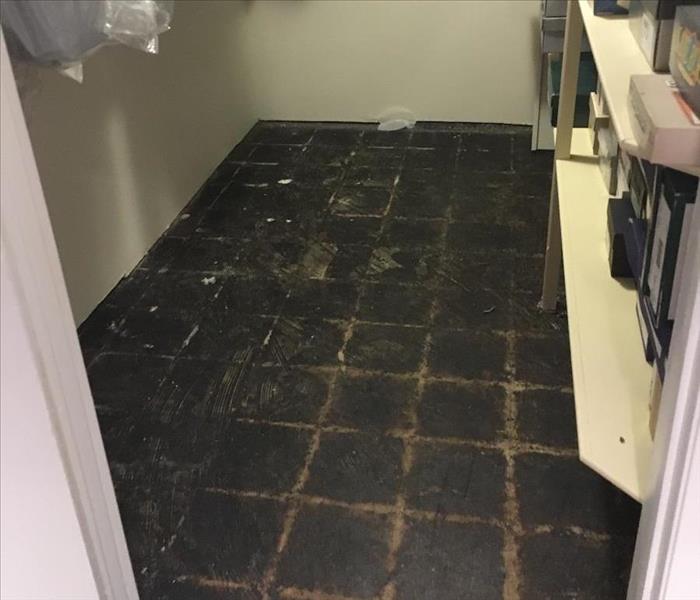 water damaged floor in closet