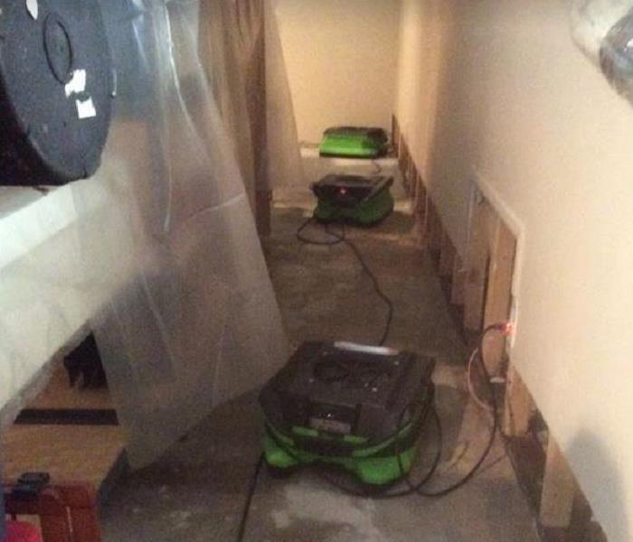 SERVPRO equipment drying water damaged floor and room